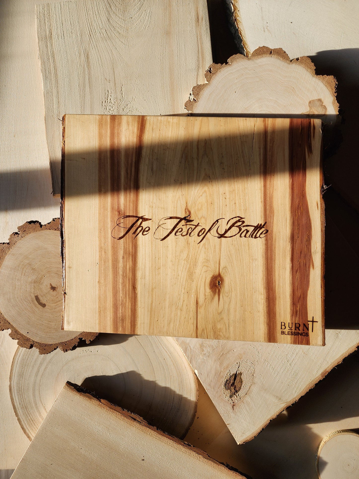 the back of a wood burned art piece with the name of the piece of art in cursive