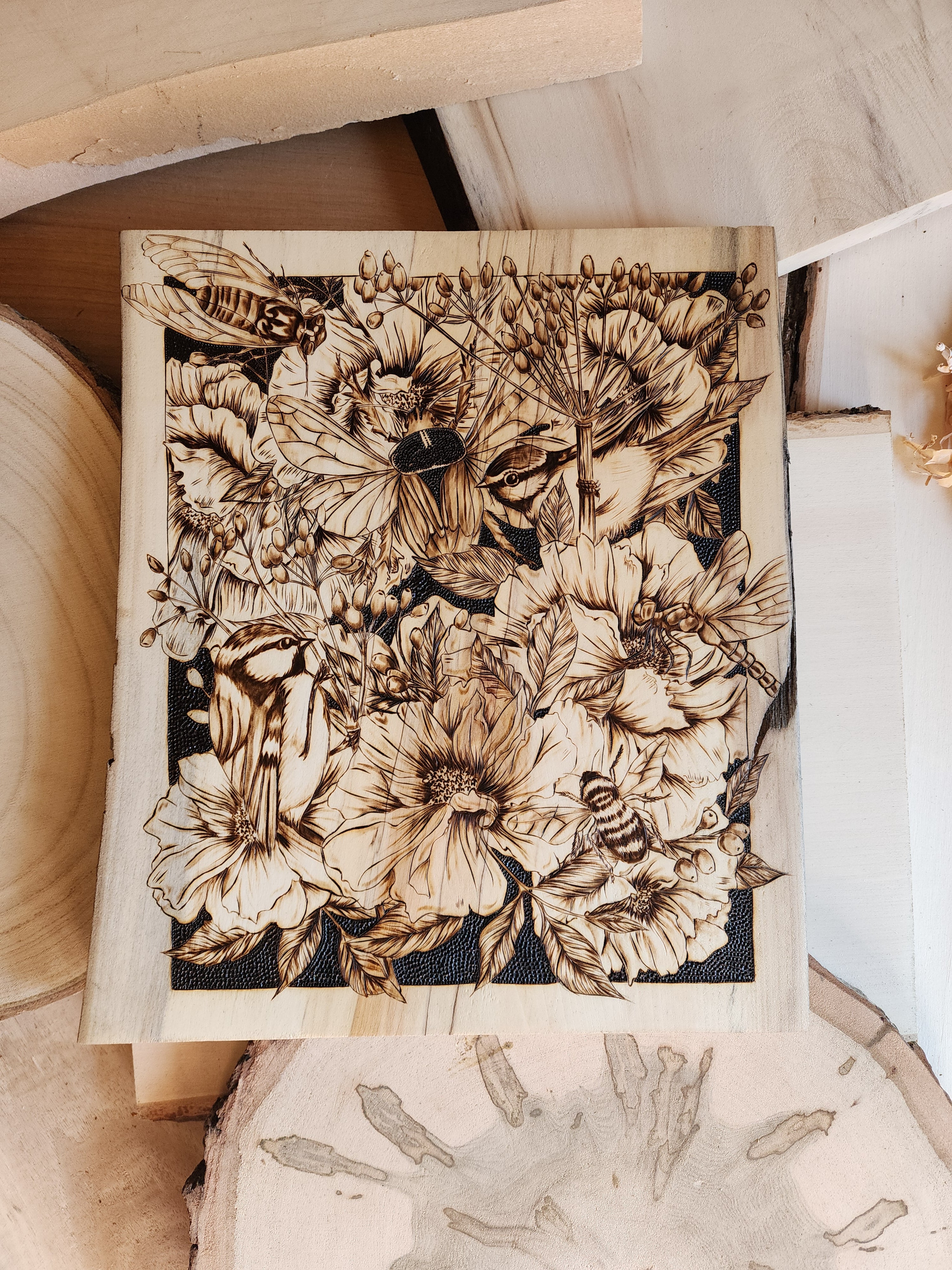 wood burned art of bees and flowers
