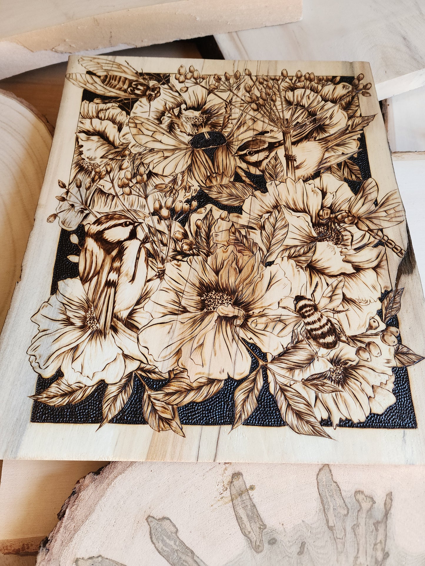 wood burned art of bees and flowers