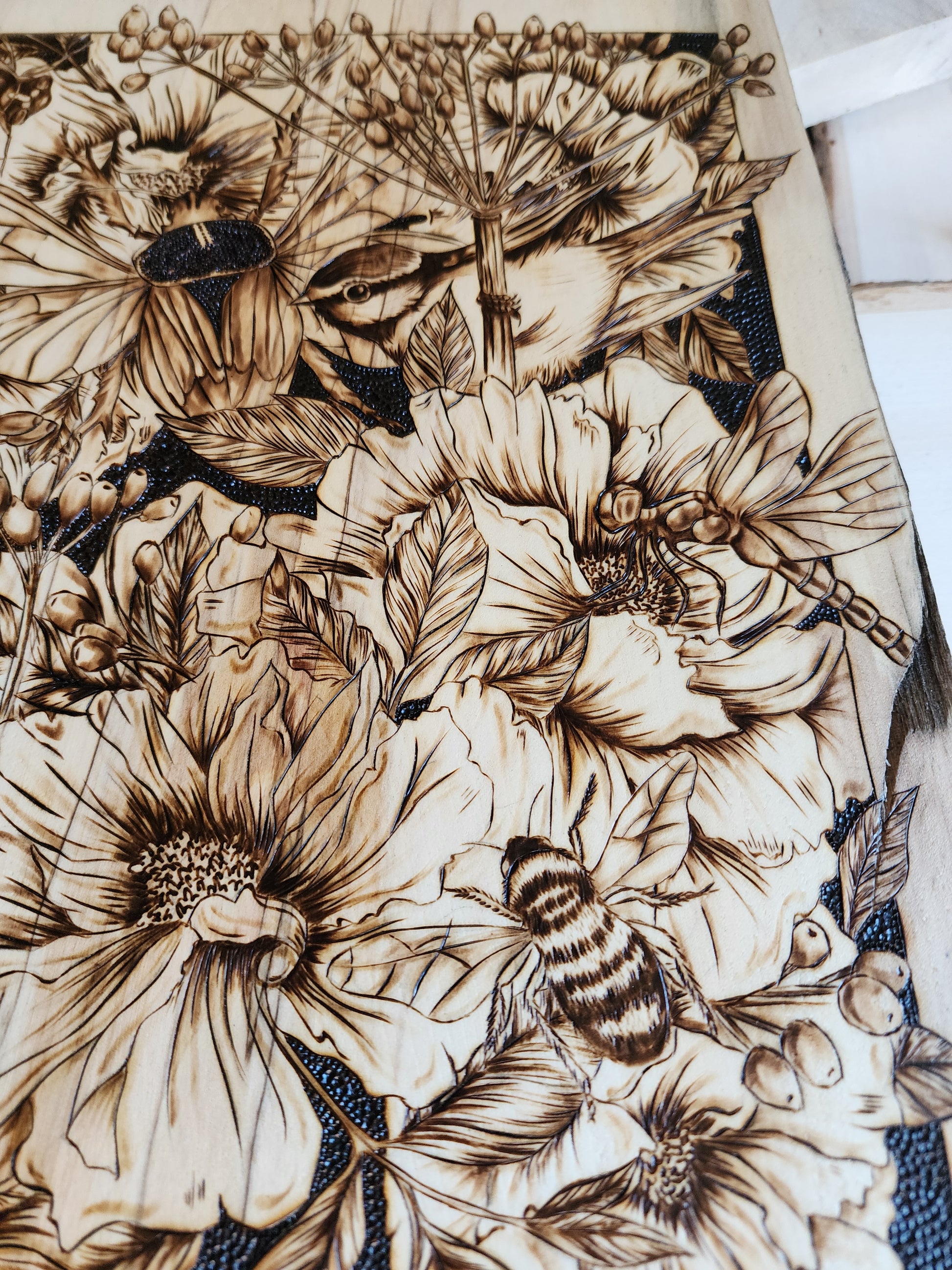 bees and flowers in wood burned art