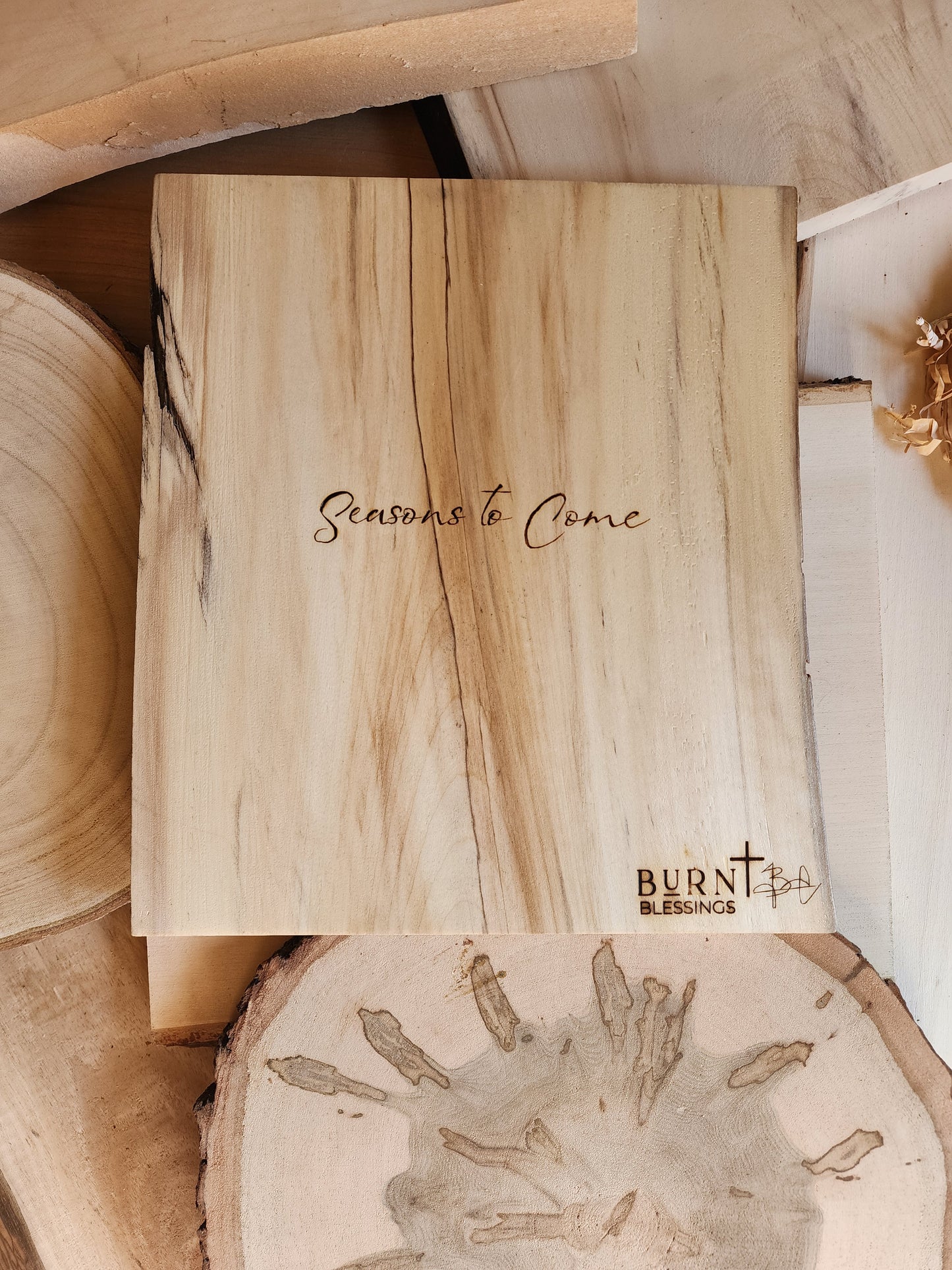 seasons to come the name of a wood burned piece of art